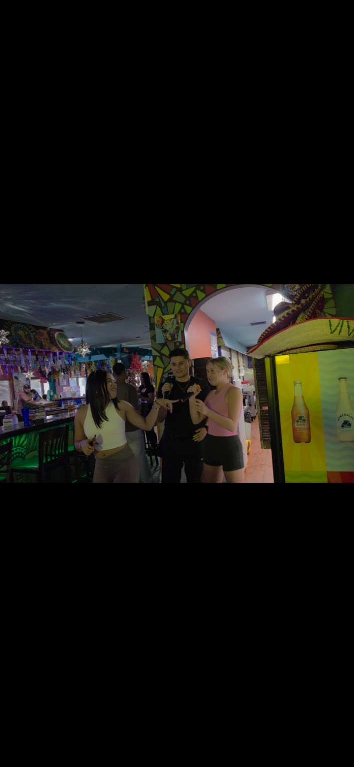 Three friends singing karaoke together