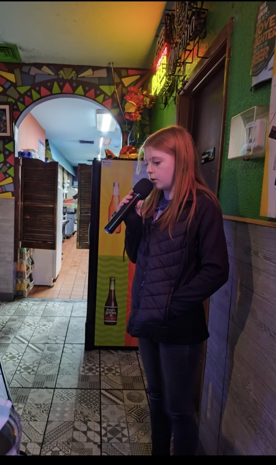 Young singer performing karaoke